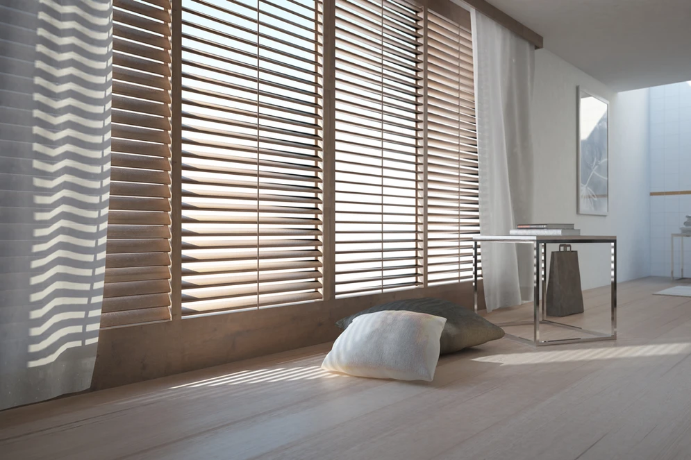 A room with wooden blinds and a white wall. A room with wooden blinds and a white wall.
